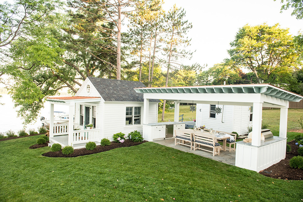 Inspiration for a small timeless white one-story wood exterior home remodel in Burlington with a hip roof