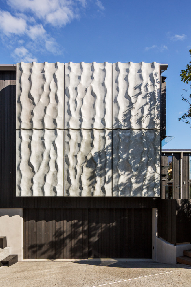 Design ideas for a contemporary house exterior in Auckland.