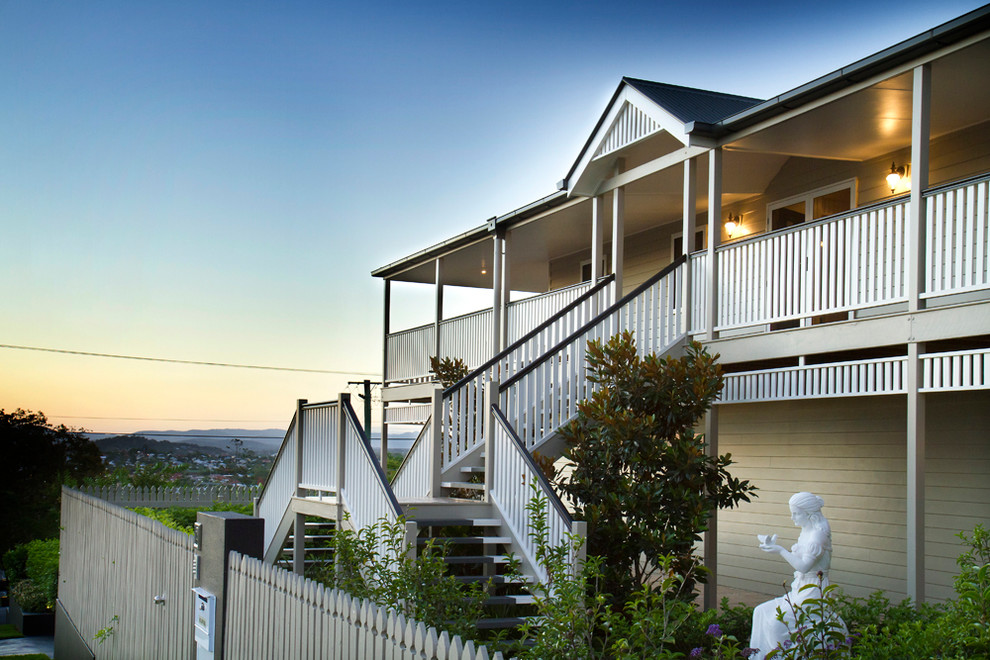 Design ideas for a large and beige traditional two floor house exterior in Brisbane with concrete fibreboard cladding.