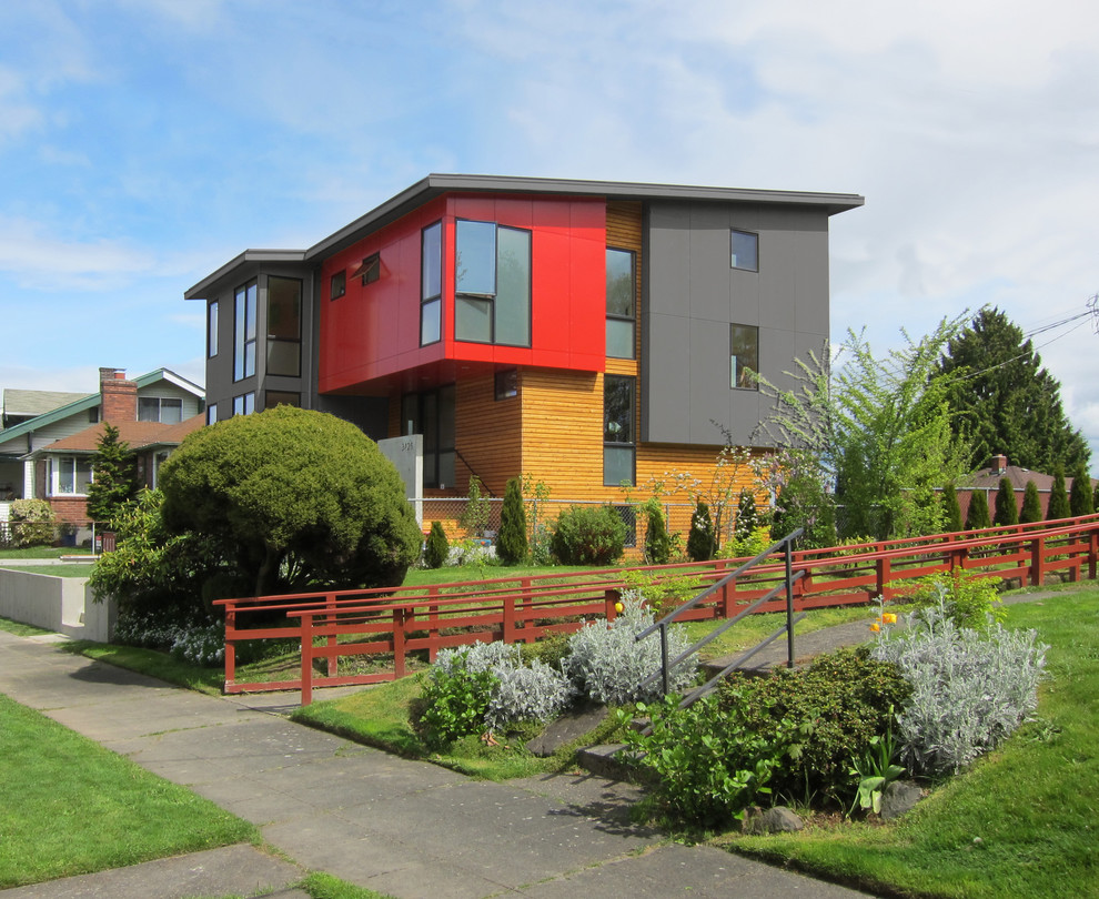 Photo of a contemporary house exterior in Seattle with mixed cladding and a lean-to roof.