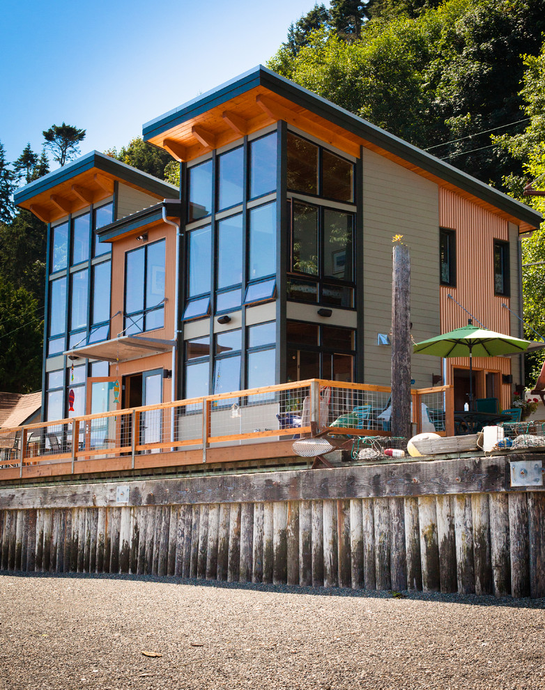 Mid-sized trendy multicolored two-story metal house exterior photo in Seattle with a shed roof
