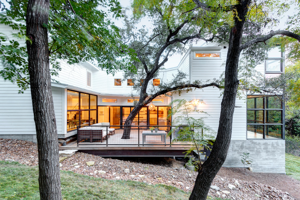 Large transitional white two-story wood exterior home idea in Austin
