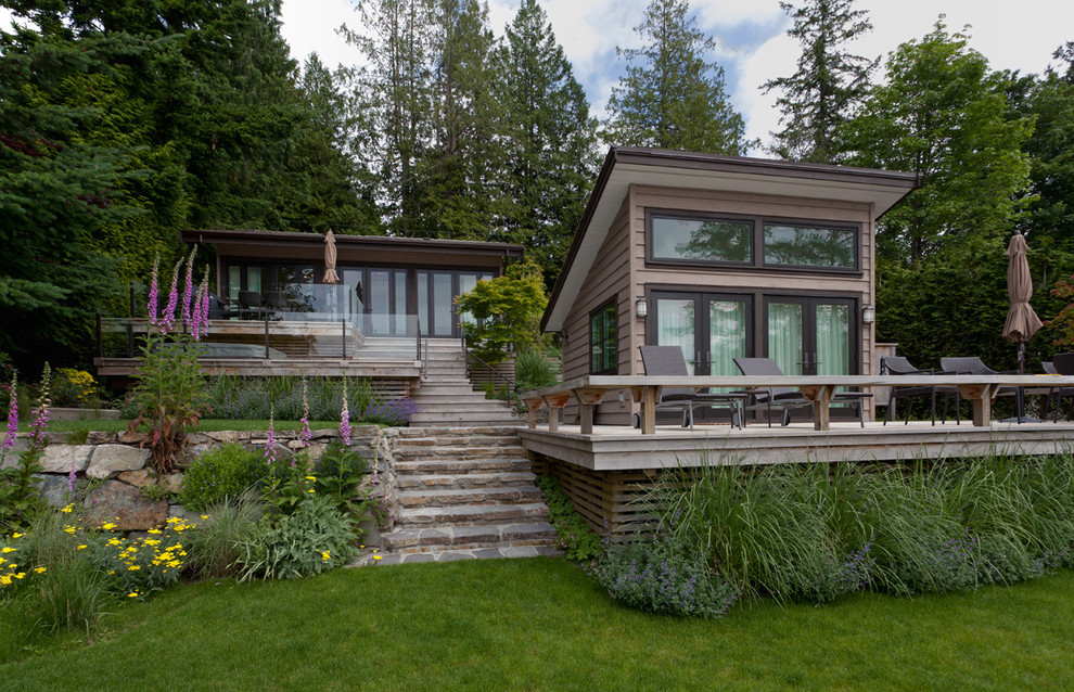 Small trendy brown one-story exterior home photo in Vancouver