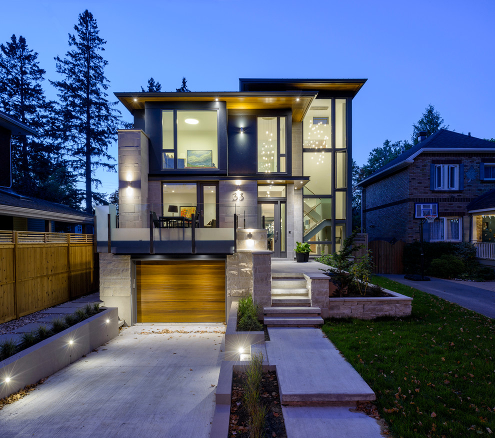 Design ideas for a contemporary house exterior in Ottawa with three floors and mixed cladding.