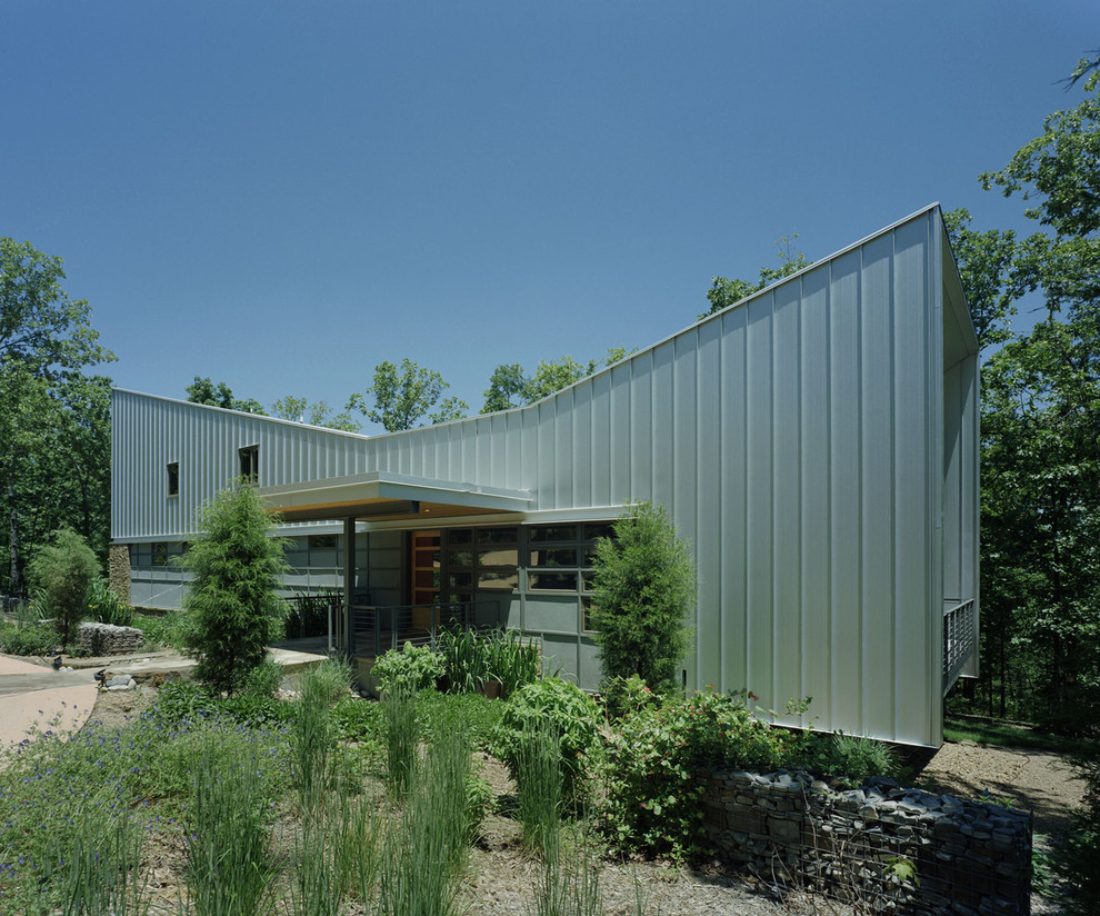 Inspiration for a modern house exterior in Other with metal cladding.