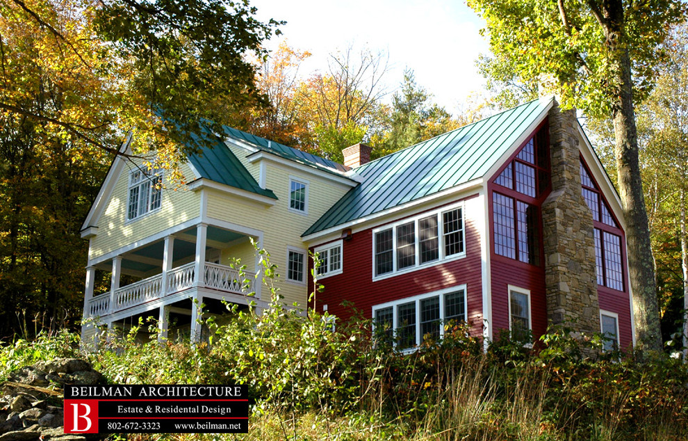 Inspiration for a mid-sized farmhouse yellow three-story wood gable roof remodel in Boston