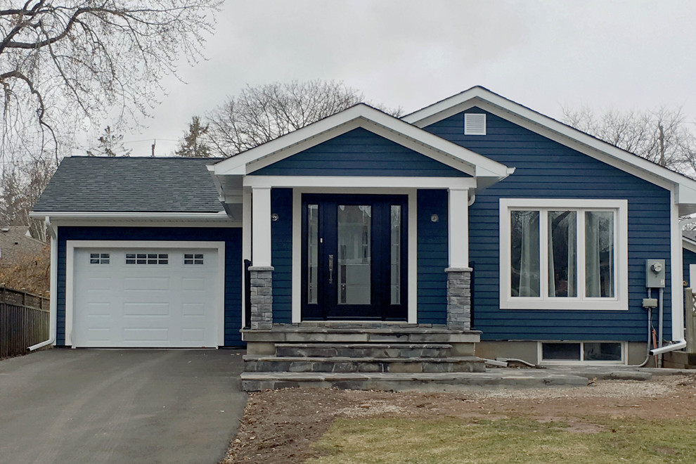 Design ideas for a medium sized and blue traditional bungalow detached house in Toronto with concrete fibreboard cladding, a pitched roof and a shingle roof.