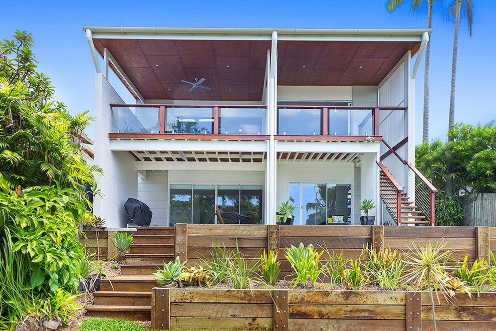 Inspiration for a large modern white two-story mixed siding exterior home remodel in Brisbane with a metal roof