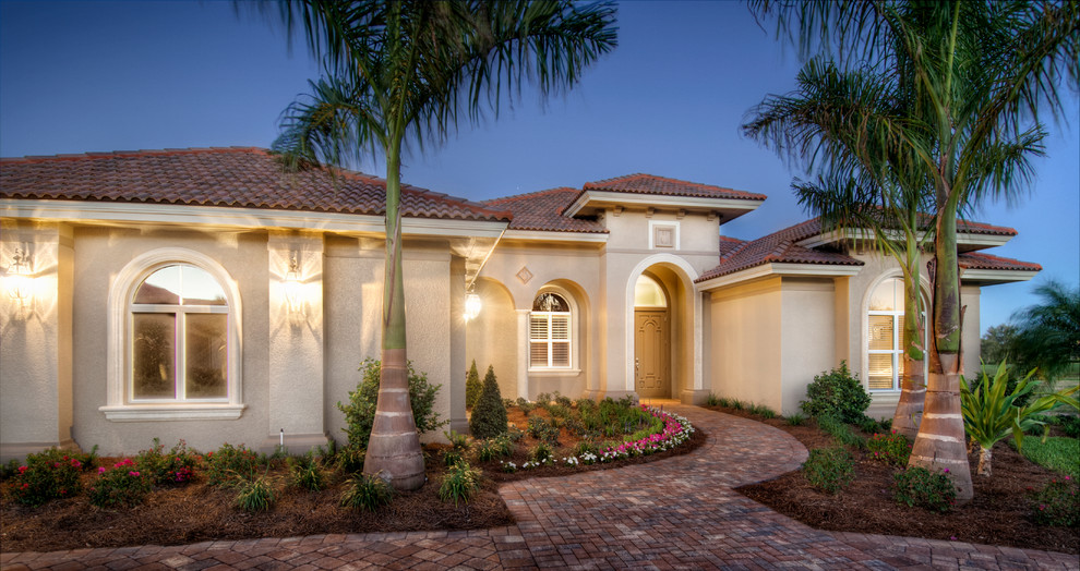 Design ideas for a mediterranean house exterior in Tampa.