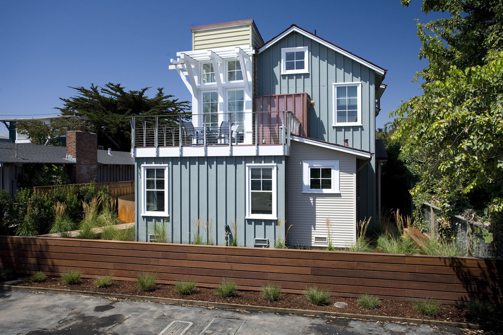 Coastal bungalow house exterior in San Francisco with wood cladding.