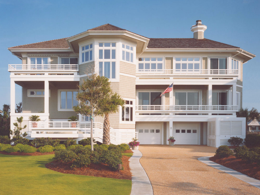 Inspiration for a large coastal gray three-story wood exterior home remodel in Other