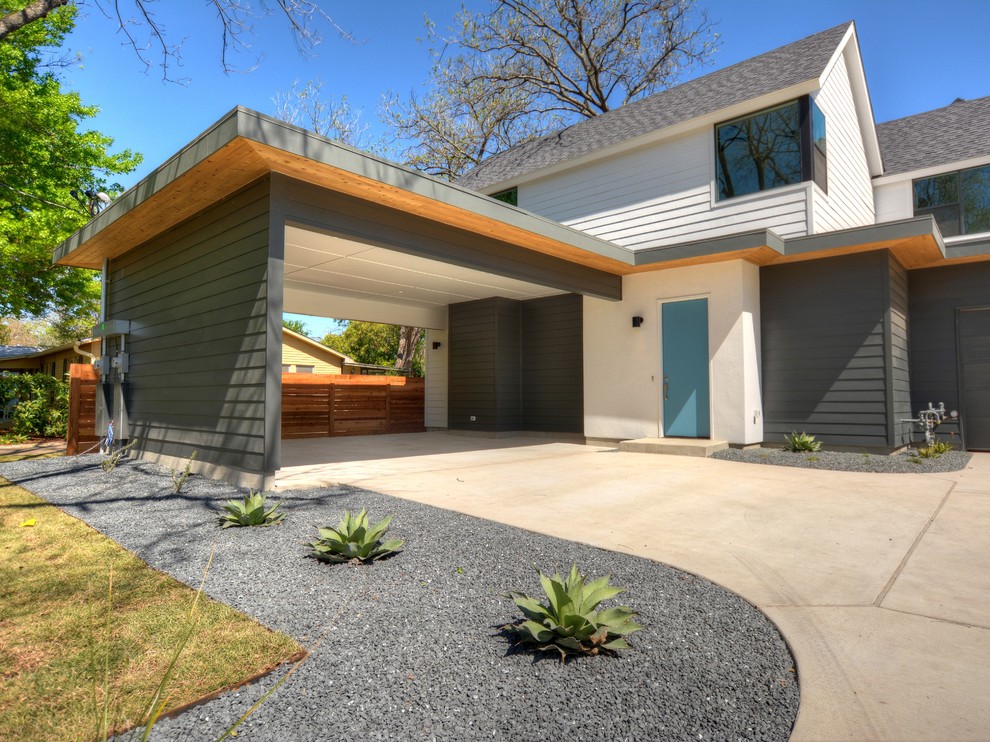 Foto de fachada de casa gris contemporánea de tamaño medio de dos plantas con revestimiento de aglomerado de cemento, tejado a dos aguas y tejado de teja de madera