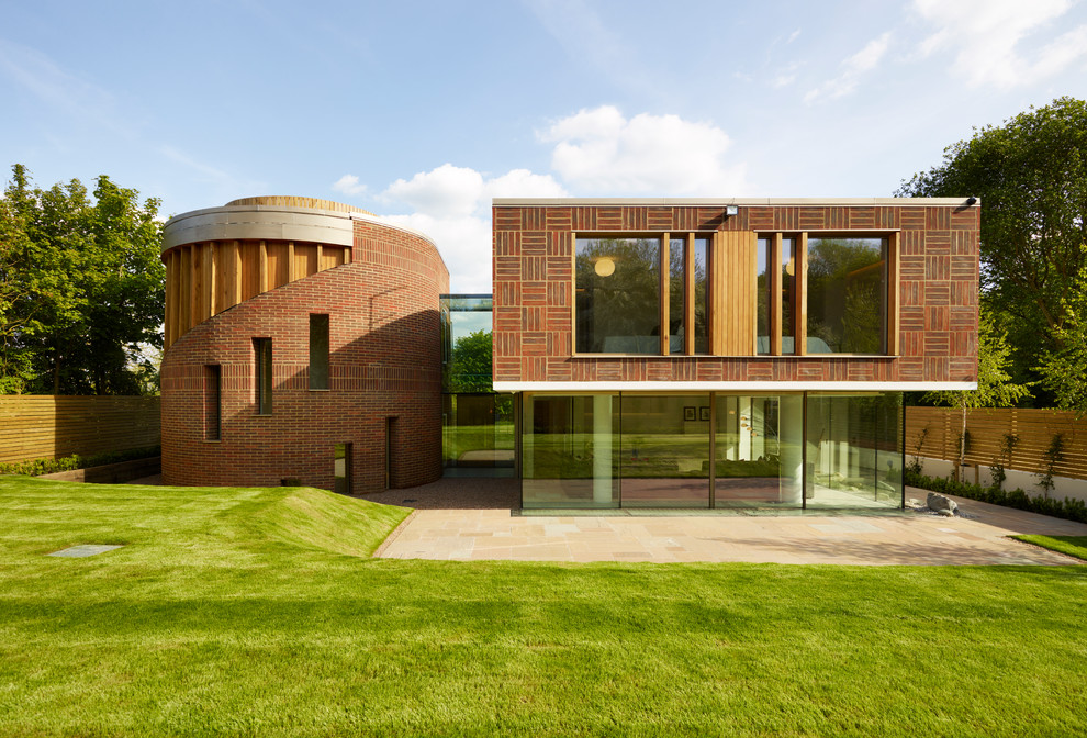 Стильный дизайн: двухэтажный дом в современном стиле с комбинированной облицовкой - последний тренд
