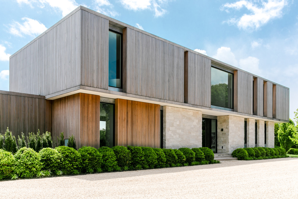 Ispirazione per la villa grande beige contemporanea a un piano con rivestimenti misti e tetto piano
