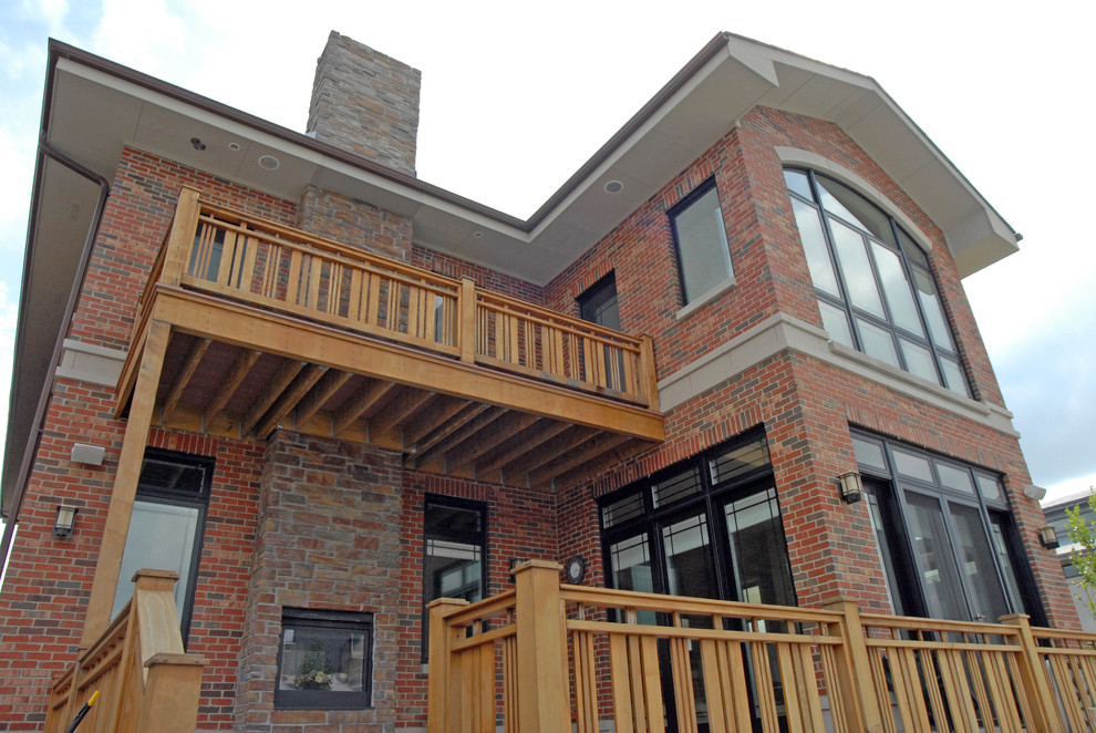 Example of a large transitional two-story brick exterior home design in Chicago