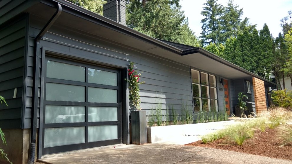 Example of a 1950s exterior home design in Portland
