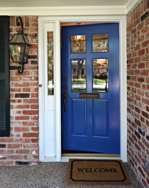 Example of a small classic red two-story brick exterior home design in Houston