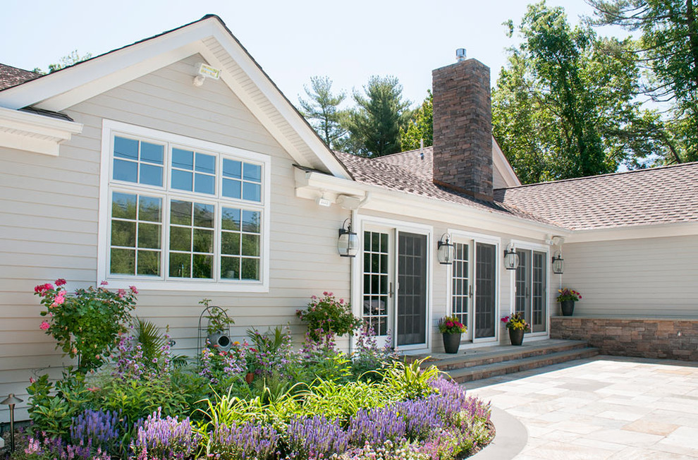 Mid-sized transitional beige one-story wood exterior home photo in Other with a shingle roof