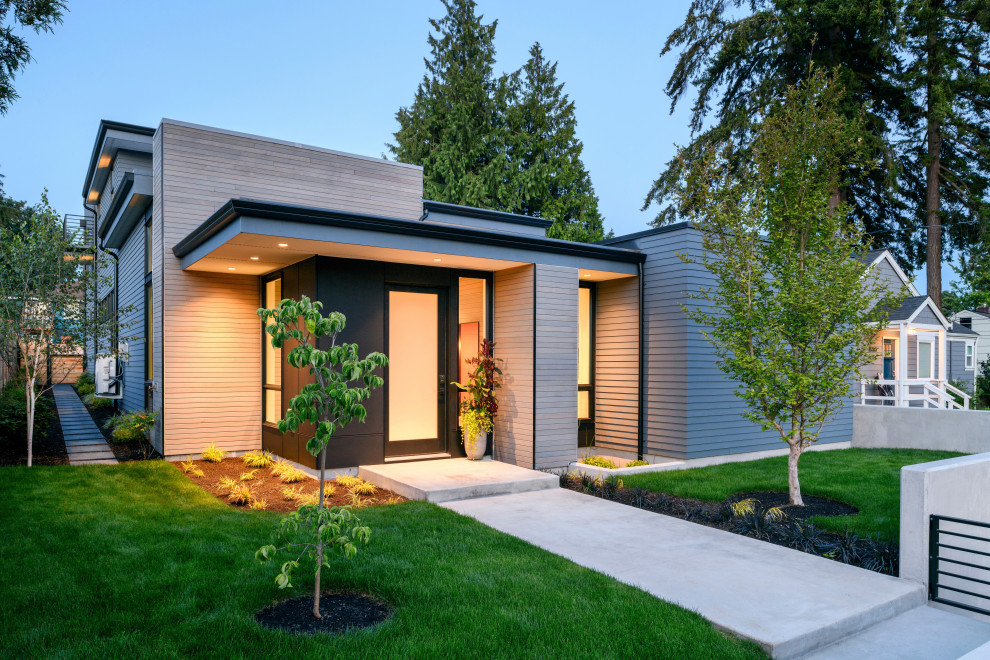 Example of a mid-sized minimalist gray two-story mixed siding exterior home design in Seattle