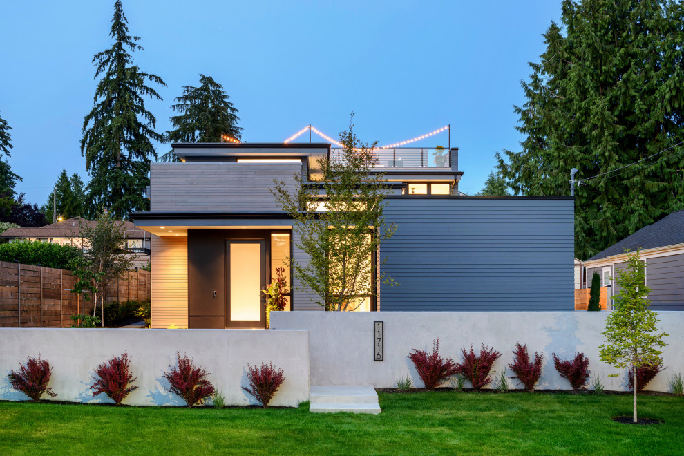 Inspiration for a mid-sized modern gray two-story mixed siding exterior home remodel in Seattle