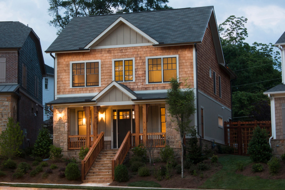This is an example of a green classic two floor house exterior in Atlanta with mixed cladding.