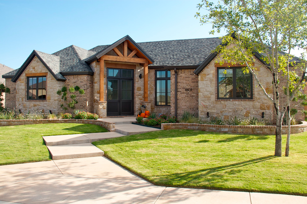 Example of a classic beige mixed siding exterior home design in Austin