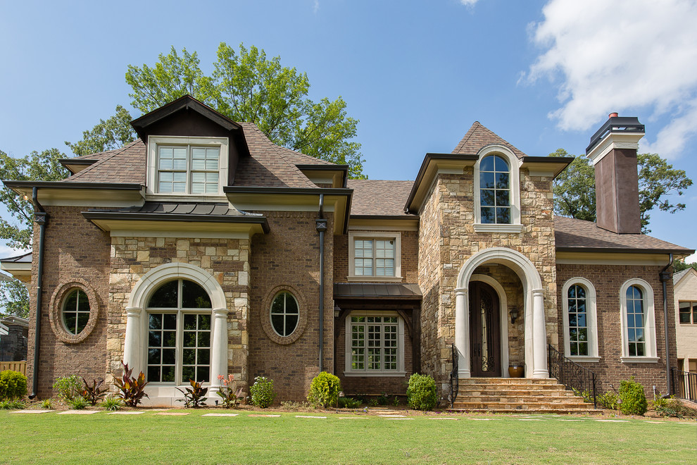Inspiration for a large and brown classic brick house exterior in Atlanta with three floors.