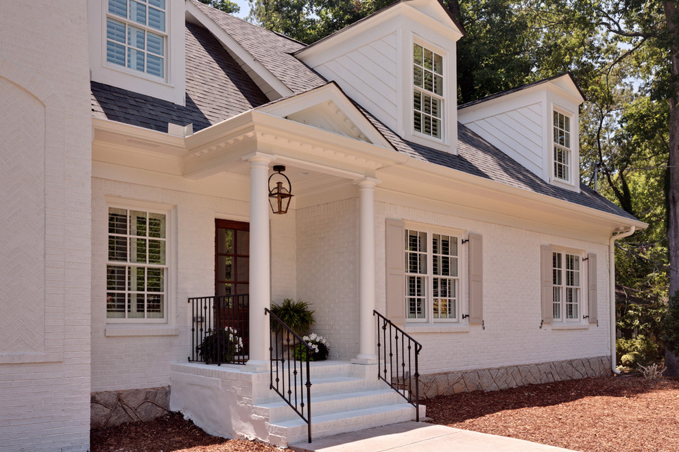 Mid-sized traditional white two-story brick gable roof idea in Atlanta