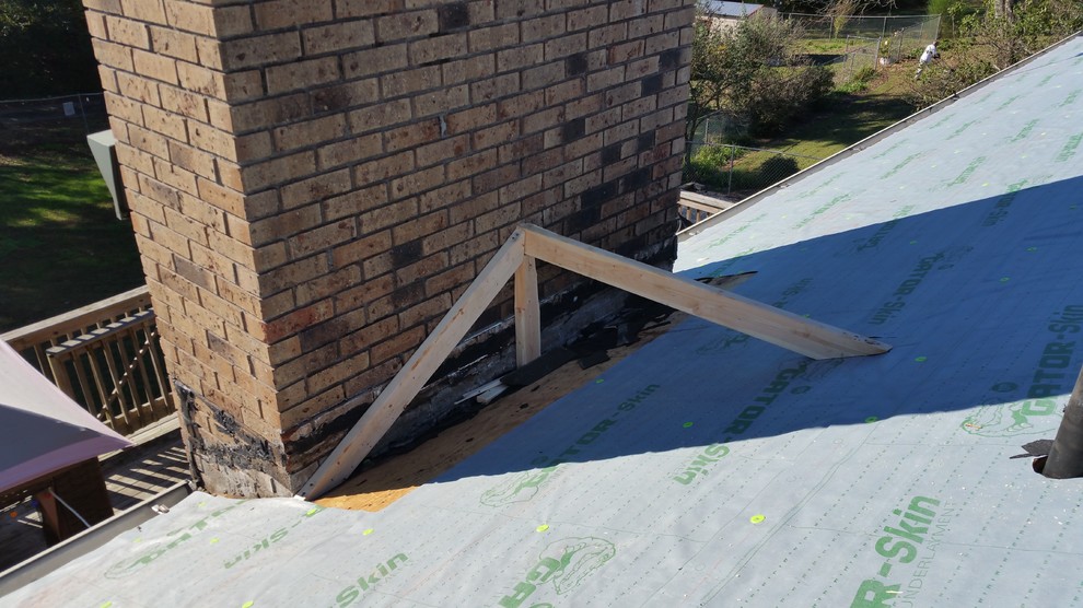 Building a Cricket behind a chimney. Exterior Atlanta by Nailed It Roofing & Restoration