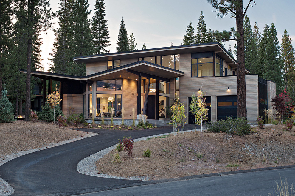 This is an example of a contemporary two floor house exterior in Sacramento with wood cladding and a flat roof.