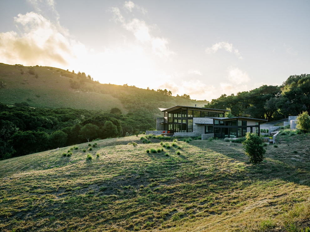 Inspiration for a contemporary two floor house exterior in San Francisco with a butterfly roof.