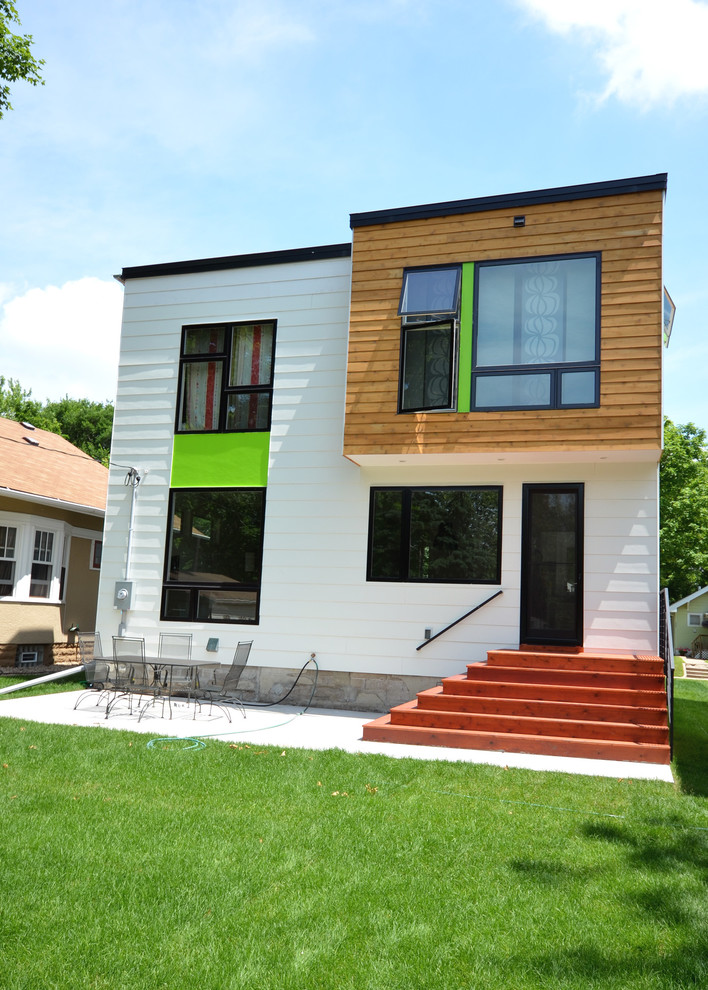 This is an example of a white modern two floor house exterior in Minneapolis with concrete fibreboard cladding.