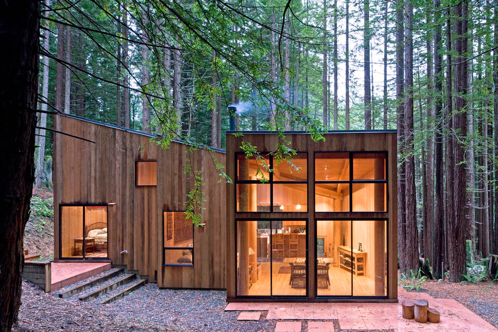Small modern split-level house exterior in San Francisco with wood cladding and a lean-to roof.