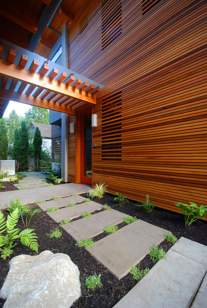 Inspiration for a contemporary two floor house exterior in Seattle with mixed cladding.
