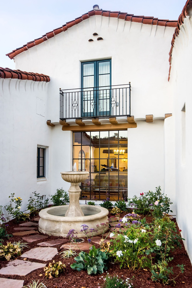 Example of a tuscan white exterior home design in San Francisco