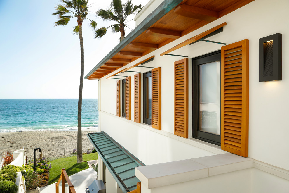 Inspiration for a large coastal exterior home remodel in Orange County
