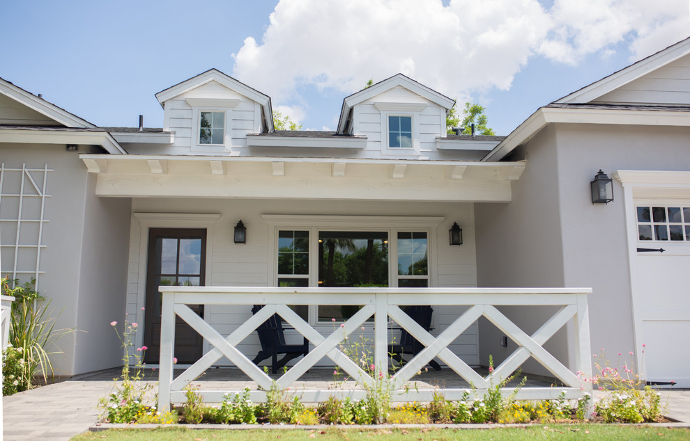 Inspiration for a mid-sized gray one-story mixed siding gable roof remodel in Phoenix