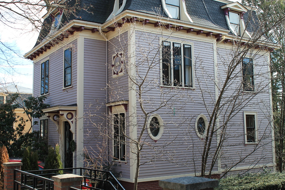 Example of an ornate purple exterior home design in Boston