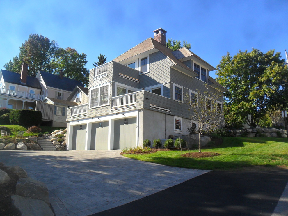 Example of a classic gray stone exterior home design in Portland Maine