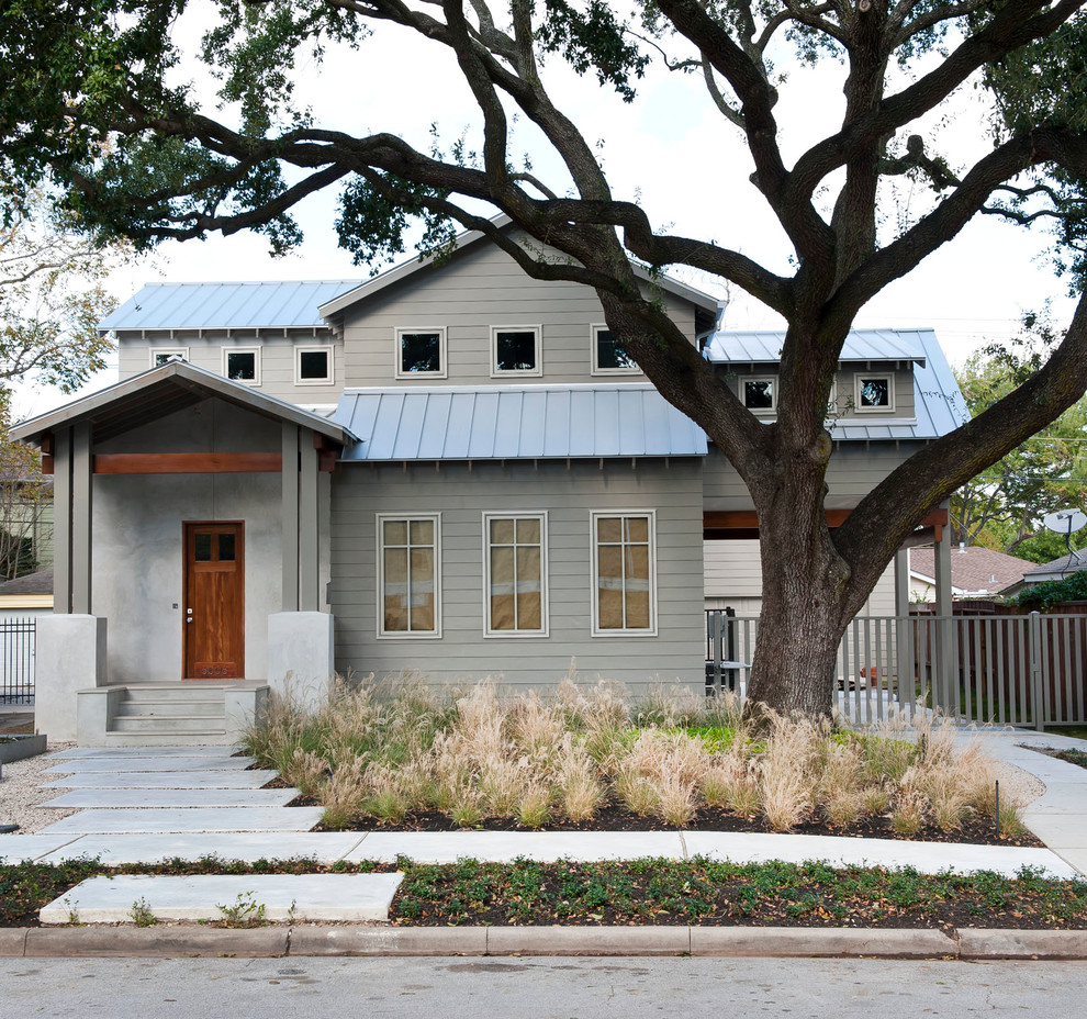 Mid-sized traditional gray two-story wood gable roof idea in Houston