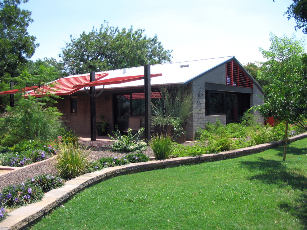 This is an example of a small and gey contemporary bungalow house exterior in Phoenix.