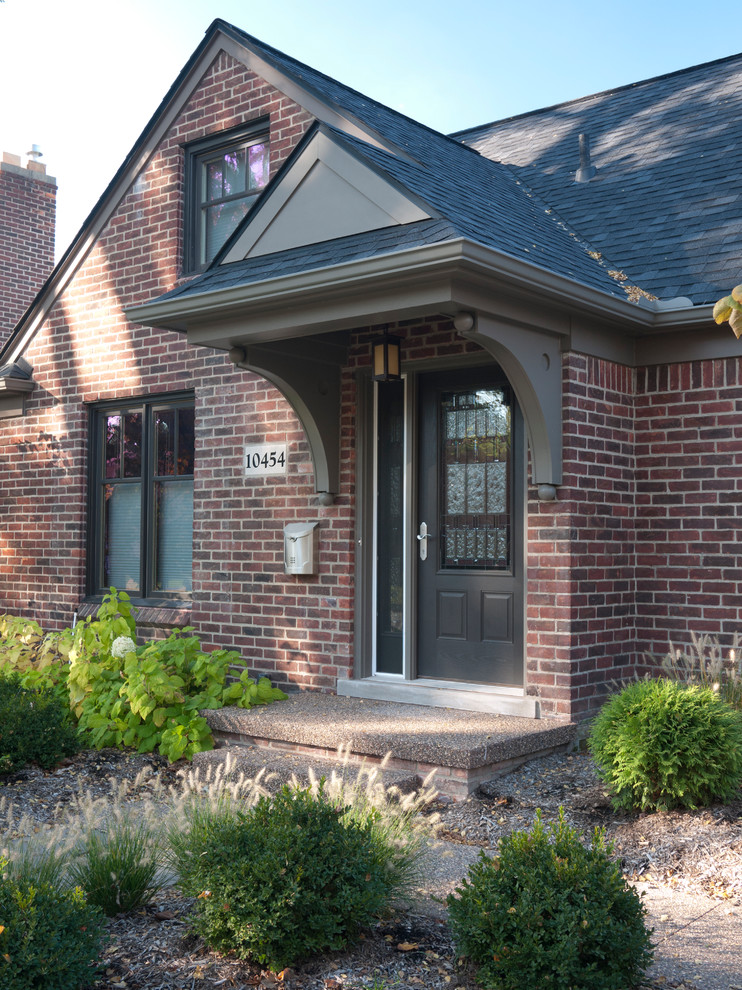 Example of a small classic brick gable roof design in Detroit
