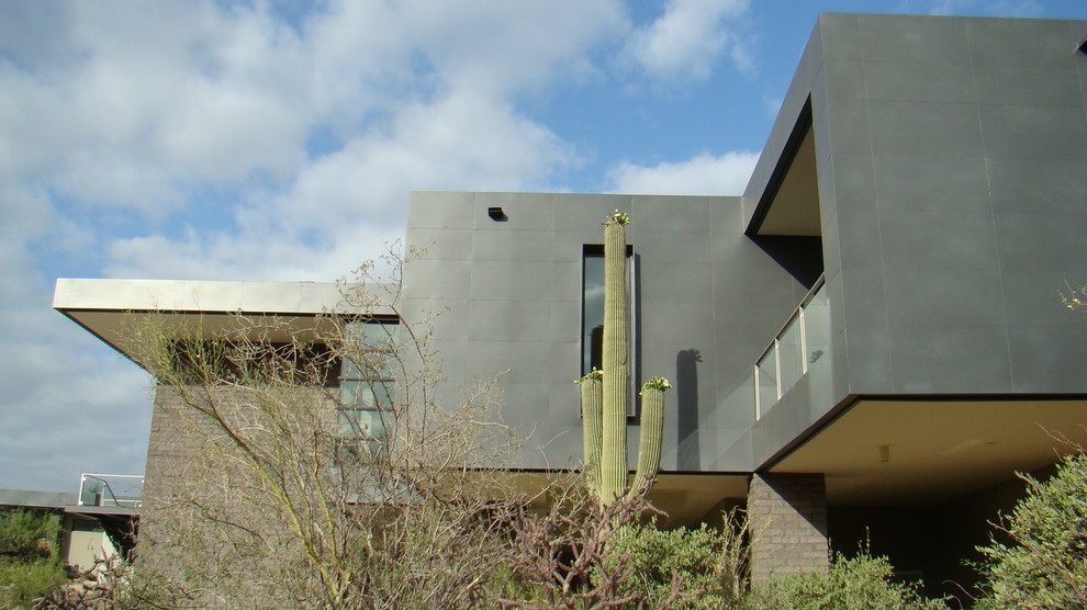 Ispirazione per la facciata di una casa grande beige contemporanea a due piani con rivestimento in mattoni