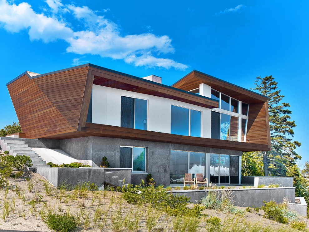 Источник вдохновения для домашнего уюта: двухэтажный дом в современном стиле с облицовкой из бетона
