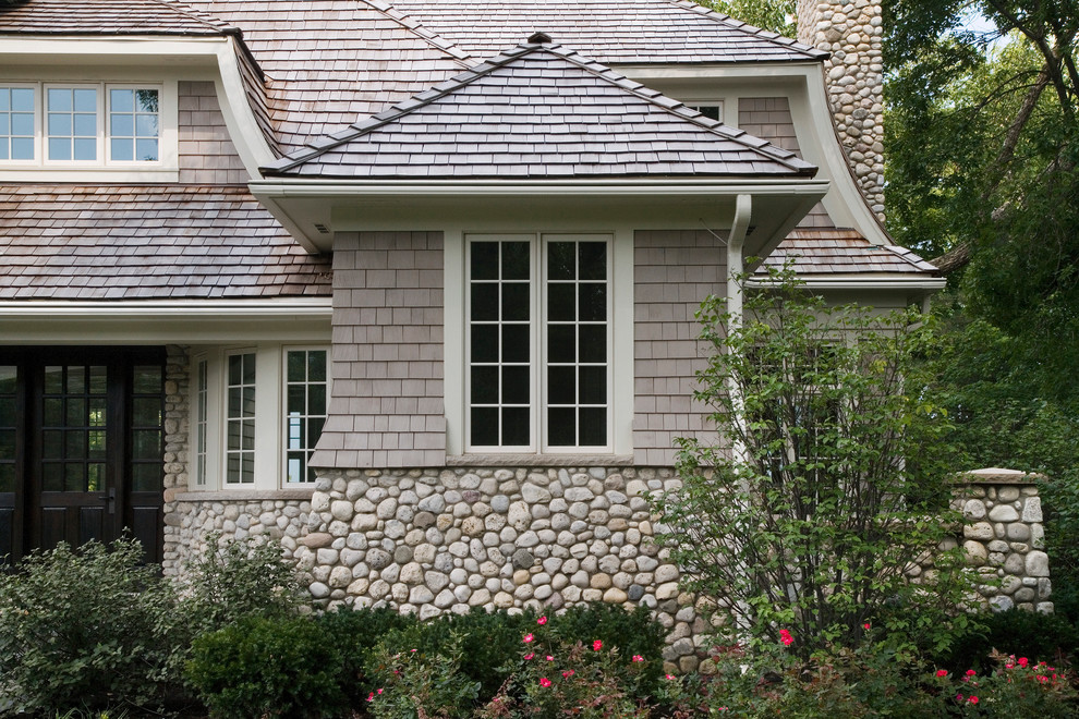 Cape Cod Shingle Style House with Stone Watertable and Cedar Shake Roof Traditional Exterior