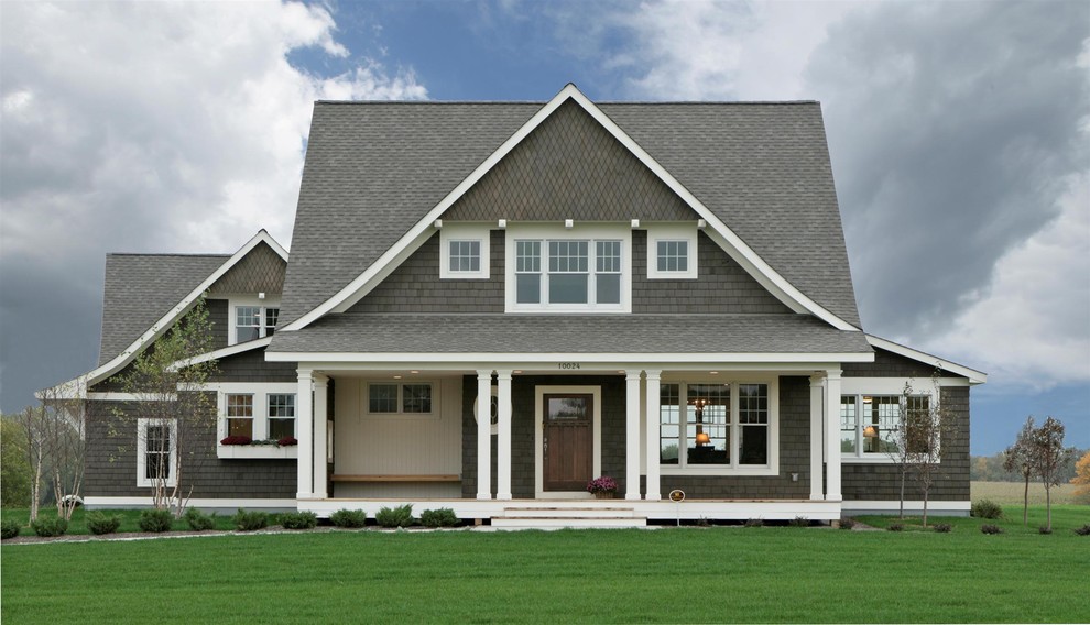 Mid-sized ornate two-story wood exterior home photo in Minneapolis