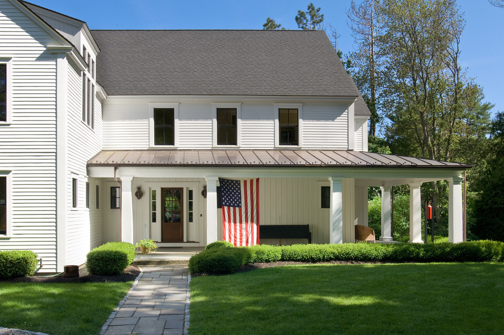 Inspiration for a timeless white two-story exterior home remodel in Portland Maine with a mixed material roof