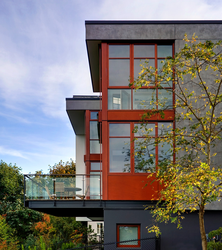 シアトルにあるコンテンポラリースタイルのおしゃれな家の外観 (コンクリートサイディング) の写真