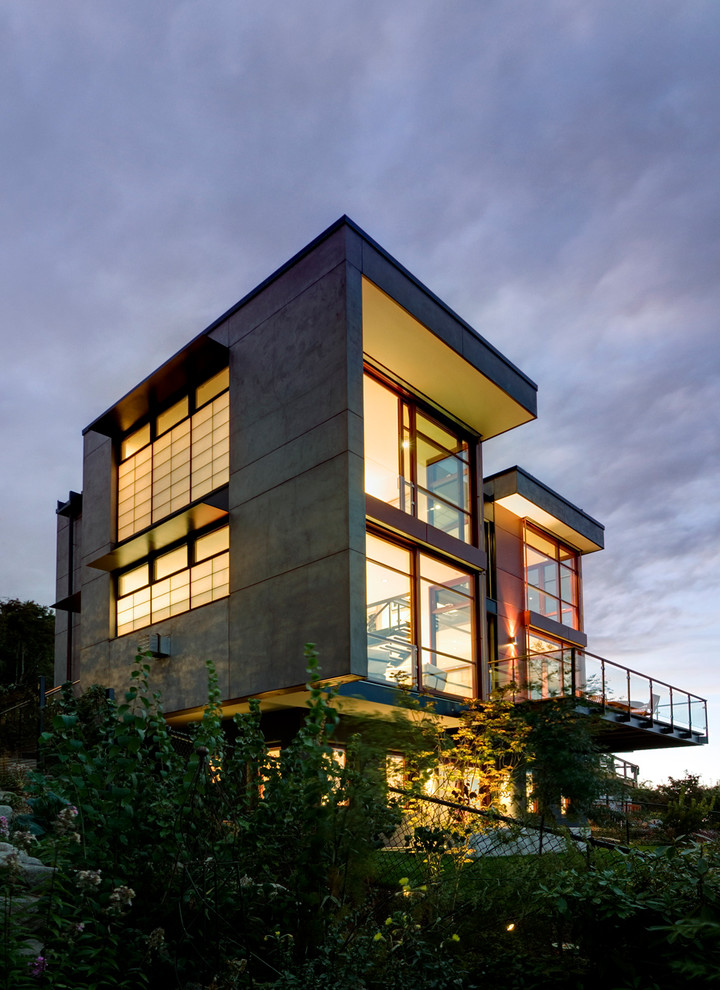 Example of a trendy concrete exterior home design in Seattle