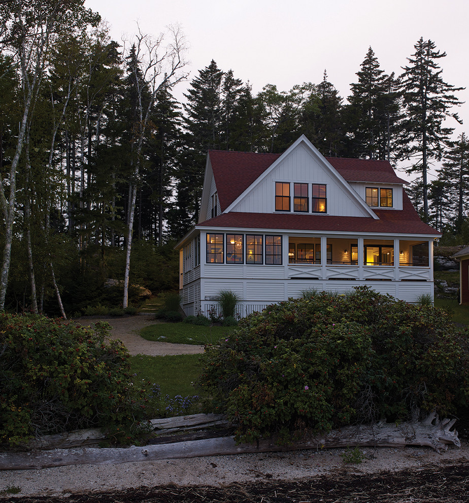 Design ideas for a white beach style house exterior in Portland Maine with wood cladding and a shingle roof.